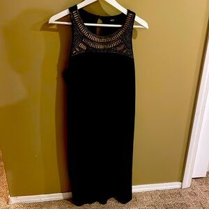 Sparkle beaded neckline! Black knit dress slightly flairs key hole back